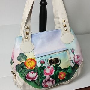 Anuschka 1827 hand-painted leather shoulder bag with a floral and rose pattern. 